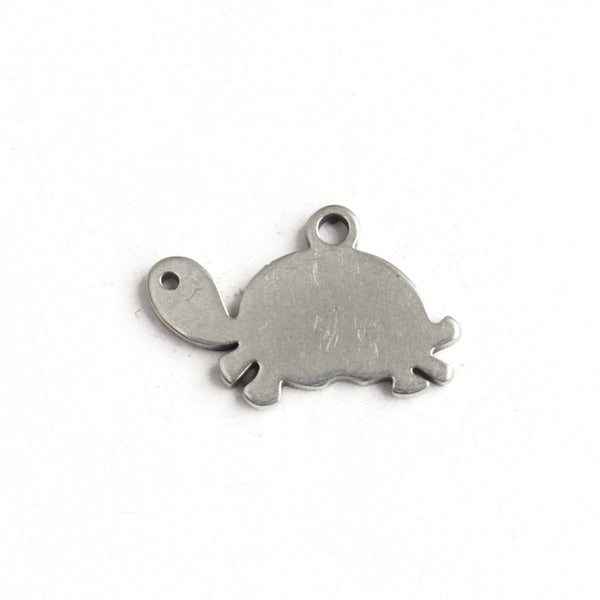 flat silver tone crawling turtle charm with small loop on top of shell