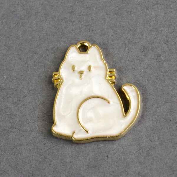 pearl white sitting cat charm with gold outline and accents