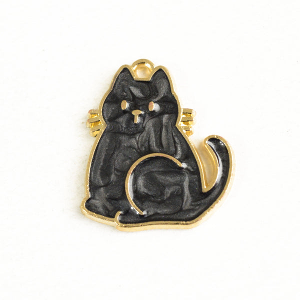 Pearl black sitting cat charm with gold outline and details