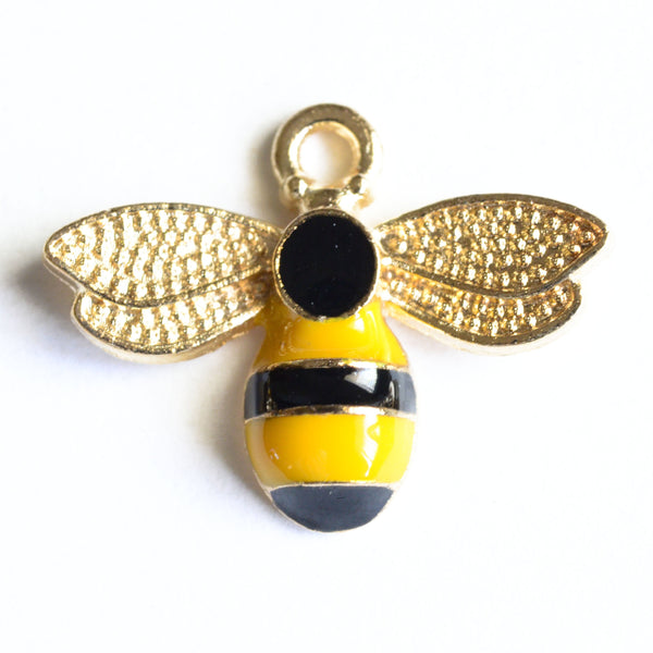 yellow and black striped bee charm with gold wings