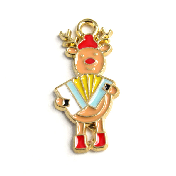 enamel charm featuring a cartoon style reindeer wearing a red cap and boots and playing a blue and yellow accordion
