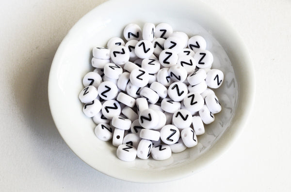Letter Z Plastic Alphabet Beads, White With Black Initial, 7mm x 3.5mm - 100 pieces (BTZ)