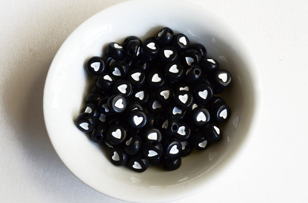 White Heart Plastic Beads, Black With White Heart, 7mm x 3.5mm - 100 pieces (BTWHEART)
