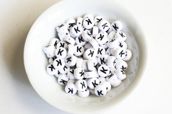 Letter K Plastic Alphabet Beads, White With Black Initial, 7mm x 3.5mm - 100 pieces (BTK)